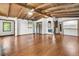 Spacious living room with wood floors, ceiling beams and a ceiling fan at 394 Shoofly Rd, Ridgeville, SC 29472