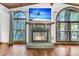 Cozy living room with a brick fireplace and large windows with natural light at 394 Shoofly Rd, Ridgeville, SC 29472