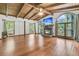 Bright living room with fireplace and large windows overlooking the lake at 394 Shoofly Rd, Ridgeville, SC 29472