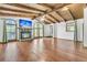 Living room boasts high ceilings, wood floors, arched windows and a fireplace with mounted tv at 394 Shoofly Rd, Ridgeville, SC 29472