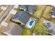 Aerial view of home with backyard pool, shed, and surrounding neighborhood at 404 Ambergate Ln, Moncks Corner, SC 29461