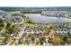 Aerial view of home with backyard pool near a lake and surrounding neighborhood at 404 Ambergate Ln, Moncks Corner, SC 29461