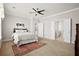 Comfortable bedroom with ceiling fan, carpet flooring, and convenient access to other rooms at 404 Ambergate Ln, Moncks Corner, SC 29461