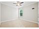 Well-lit bedroom with plush carpeting, and a ceiling fan at 404 Ambergate Ln, Moncks Corner, SC 29461