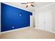 Comfortable bedroom with a bold accent wall, plush carpeting, and double door closet at 404 Ambergate Ln, Moncks Corner, SC 29461