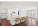 A spacious kitchen with hardwood floors, an island with seating, and stainless steel appliances at 404 Ambergate Ln, Moncks Corner, SC 29461