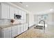 A kitchen featuring hardwood floors, a granite countertop, stainless steel microwave and decorative backsplash at 404 Ambergate Ln, Moncks Corner, SC 29461