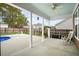 The covered back patio features a view of the pool and rocking chairs at 404 Ambergate Ln, Moncks Corner, SC 29461