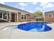 Backyard pool with stone border and ladder, and a covered patio near the house at 404 Ambergate Ln, Moncks Corner, SC 29461
