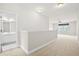 Upstairs landing with plush carpeting and a view into the secondary bathroom at 404 Ambergate Ln, Moncks Corner, SC 29461