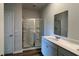 Bathroom featuring glass shower, double vanity and white cabinets at 405 Mistflower Ln, Moncks Corner, SC 29461