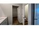 Bathroom featuring white vanity, tile floors and view to closet at 405 Mistflower Ln, Moncks Corner, SC 29461