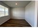 Cozy bedroom space with natural light, wood flooring, and neutral walls at 405 Mistflower Ln, Moncks Corner, SC 29461