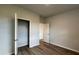 This bedroom features modern wood-look floors, base trim, and a closet with an open door at 407 Mistflower Ln, Moncks Corner, SC 29461