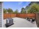 Enclosed backyard featuring a concrete patio, privacy fence, chairs and modern air conditioning unit at 4120 Veritas St, Charleston, SC 29414