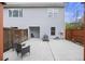 Backyard concrete patio with seating, a modern air conditioner, and partial fencing for enhanced privacy at 4120 Veritas St, Charleston, SC 29414
