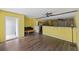 Spacious basement featuring wood look tile floors, two ceiling fans, and half wall for separation at 4120 Veritas St, Charleston, SC 29414