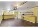 Open basement layout with a small bar and ceiling fans; ready to be transformed at 4120 Veritas St, Charleston, SC 29414