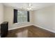 Cozy bedroom with hardwood floors, a ceiling fan, and plenty of natural light at 4120 Veritas St, Charleston, SC 29414