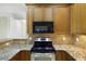 Well-equipped kitchen features granite countertops, stainless steel appliances, and ample cabinet space at 4120 Veritas St, Charleston, SC 29414