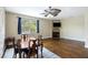Open concept living room featuring fireplace, wood floors, and lots of natural light at 4120 Veritas St, Charleston, SC 29414