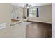 View of living room with granite counters and hardwood floors at 4120 Veritas St, Charleston, SC 29414