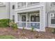 Exterior view of a private balcony with seating for enjoying the outdoors at 45 Sycamore Ave # 116, Charleston, SC 29407