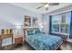 This spacious bedroom features a ceiling fan, and a large window that provides plenty of natural light at 45 Sycamore Ave # 116, Charleston, SC 29407