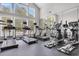 Well-equipped gym with treadmills, elliptical machines, and ample natural light at 45 Sycamore Ave # 116, Charleston, SC 29407