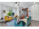 Bright living room featuring hardwood floors, large window, comfortable seating, and stylish furnishings at 45 Sycamore Ave # 116, Charleston, SC 29407