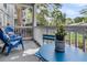 The patio features a blue outdoor chair and table set, with a view of the surrounding landscape at 45 Sycamore Ave # 116, Charleston, SC 29407