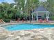 Outdoor pool featuring brick pavers, a gazebo, and multiple lounge chairs for relaxation at 45 Sycamore Ave # 116, Charleston, SC 29407