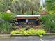 A welcoming entrance sign for 'Concord West of the Ashley' with lush foliage at 45 Sycamore Ave # 116, Charleston, SC 29407