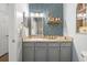 Charming bathroom showcases a unique wallpaper design, a vanity with storage, and well-lit mirror providing a stylish space at 45 Sycamore Ave # 536, Charleston, SC 29407