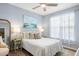 Cozy bedroom featuring light blue walls, a ceiling fan, a comfortable bed, and plenty of natural light from the window at 45 Sycamore Ave # 536, Charleston, SC 29407