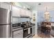 Modern kitchen with stainless steel appliances, and adjacent dining area at 45 Sycamore Ave # 536, Charleston, SC 29407