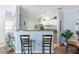 Contemporary kitchen area with breakfast bar seating and sleek countertops at 45 Sycamore Ave # 536, Charleston, SC 29407