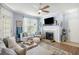 Inviting living room with a fireplace, stylish decor, and comfortable seating arrangement at 45 Sycamore Ave # 536, Charleston, SC 29407