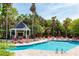 Inviting pool area with shaded gazebo, lounge chairs, and lush landscaping, creating a serene outdoor oasis at 45 Sycamore Ave # 536, Charleston, SC 29407
