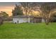 Expansive backyard with well maintained lawn, privacy fence, and screened in porch at 5337 Hartford Cir, North Charleston, SC 29405