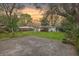 Backyard featuring large trees, lawn and an outdoor concrete pad perfect for entertaining or relaxing at sunset at 5337 Hartford Cir, North Charleston, SC 29405