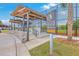 Park's baseball field at Park Circle offers a covered viewing area with bleachers and a paved walkway at 5337 Hartford Cir, North Charleston, SC 29405