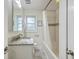 Bathroom features granite top vanity, subway tiled shower/tub, and light grey flooring at 5337 Hartford Cir, North Charleston, SC 29405