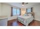 Cozy bedroom featuring hardwood floors, a ceiling fan, natural light, and comfortable furnishings at 5337 Hartford Cir, North Charleston, SC 29405