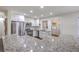 Bright kitchen featuring granite countertops, stainless steel appliances, white cabinetry, and hardwood flooring at 5337 Hartford Cir, North Charleston, SC 29405