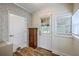 Bright mud room features brick wall, hardwood floors, storage cabinet, and a door to the backyard at 5337 Hartford Cir, North Charleston, SC 29405