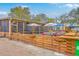 Cozy outdoor patio featuring wooden fencing, seating, and overhead shade structures for a relaxed dining experience at 5337 Hartford Cir, North Charleston, SC 29405
