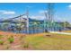 Modern playground with shade coverings offers a secure, fun area, with vibrant play equipment and safety fencing at 5337 Hartford Cir, North Charleston, SC 29405