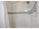 Close up of a shower with subway tile and mosaic accent, and chrome fixtures at 5337 Hartford Cir, North Charleston, SC 29405