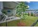 Backyard patio with comfortable seating and well-maintained landscaping, perfect for outdoor enjoyment at 603 Dunswell Dr, Summerville, SC 29486